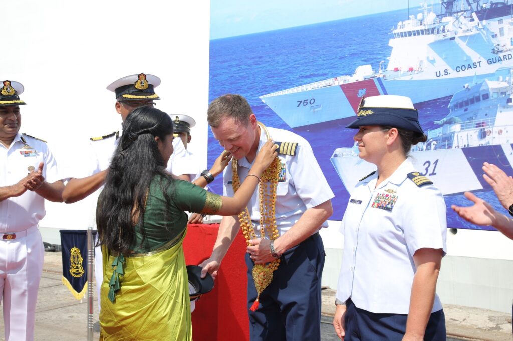 Garland to Senior Official's of USCG Bertholf Ship, as symbol of WELCOME at Haddo, port Blair 